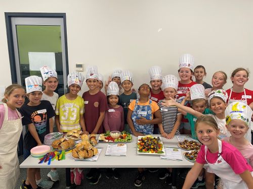 Group shot of kids participating in the Junior Kitchen workshop